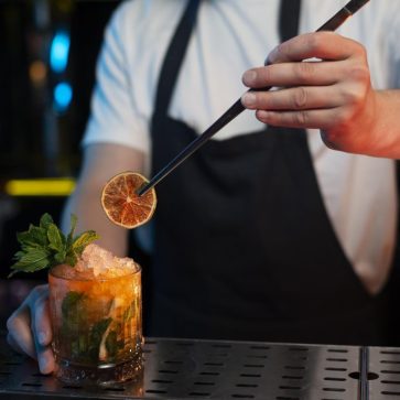 bartender-making-delicious-refreshing-cocktail