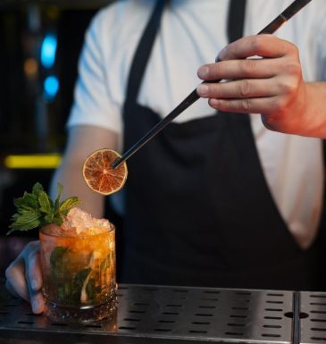 bartender-making-delicious-refreshing-cocktail